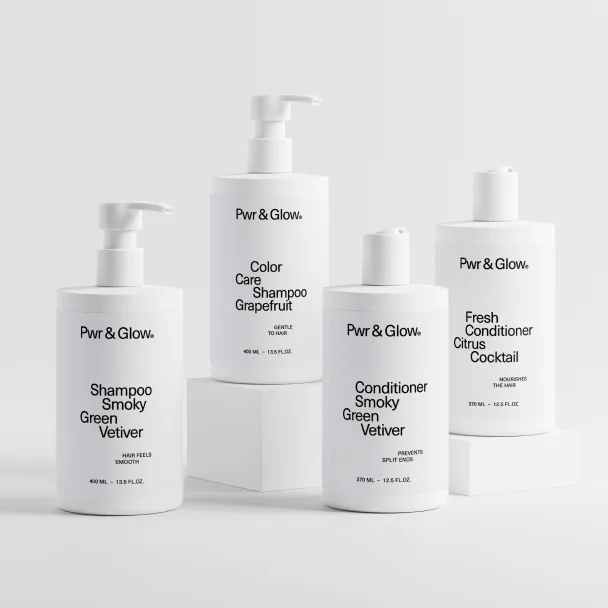 Fbr & Glow shampoo and conditioner bottle set displayed together.