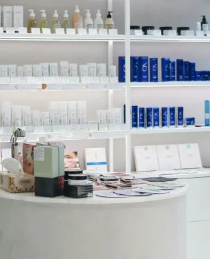 Retail shelf display of skincare products arranged in a boutique store.